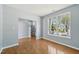 Open floor plan showcasing hardwood floors, large windows, and staircase at 3604 Rivermist Dr, Raleigh, NC 27610