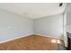 Bright living room boasts hardwood floors, fresh paint, modern fireplace, and large windows for natural light at 3604 Rivermist Dr, Raleigh, NC 27610