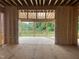 Framed living room with a view of the screened-in porch and trees beyond at 3608 Cobbler Vw Way, Fuquay Varina, NC 27526