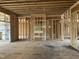 Framing stage of new home with open floorplan and a staircase at 3608 Cobbler Vw Way, Fuquay Varina, NC 27526