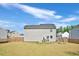 Spacious backyard featuring a patio, swing set, and well-maintained lawn, ideal for recreation at 390 Hunting Wood Dr, Angier, NC 27501