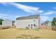Wide backyard with a patio set and a swing set, perfect for outdoor gatherings and Gathering fun at 390 Hunting Wood Dr, Angier, NC 27501