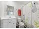 Bright bathroom featuring modern fixtures, vanity with storage, and a charming koala-themed shower curtain at 390 Hunting Wood Dr, Angier, NC 27501