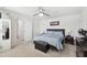 Comfortable bedroom with a queen-size bed with a brown headboard and light blue bedding, along with dark wood furnishings at 390 Hunting Wood Dr, Angier, NC 27501