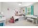 Cute bedroom with a daybed, turquoise curtains, lots of stuffed animals and other adorable decor at 390 Hunting Wood Dr, Angier, NC 27501