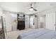 Bright bedroom featuring a ceiling fan and television, offering a relaxing space with natural light and neutral decor at 390 Hunting Wood Dr, Angier, NC 27501