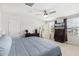 Comfortable bedroom with a ceiling fan and television, offering a relaxing space with natural light and neutral decor at 390 Hunting Wood Dr, Angier, NC 27501