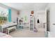 Charming bedroom features a daybed, turquoise curtains, lots of stuffed animals and an electric piano at 390 Hunting Wood Dr, Angier, NC 27501