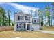Inviting two-story home with fresh landscaping and a well-manicured lawn, perfect for families at 390 Hunting Wood Dr, Angier, NC 27501