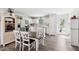 Bright kitchen with white cabinets, stainless steel appliances, an island, and a dining area at 390 Hunting Wood Dr, Angier, NC 27501