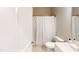 Neutral bathroom with a toilet, shower with curtain, and a vanity with sink at 395 Carolina Landing Dr, Zebulon, NC 27597