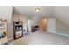 Spacious bonus room featuring carpet flooring and a storage cabinet at 395 Carolina Landing Dr, Zebulon, NC 27597