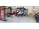 Well-organized garage space with gym equipment, shelving, and ample storage options at 395 Carolina Landing Dr, Zebulon, NC 27597