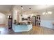 Modern kitchen featuring a large island, stainless steel appliances, and pendant lighting at 395 Carolina Landing Dr, Zebulon, NC 27597