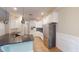 Kitchen featuring an island, stainless steel appliances, and modern white cabinets at 395 Carolina Landing Dr, Zebulon, NC 27597