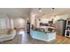 Gourmet kitchen with stainless steel appliances, granite countertops, and custom cabinets at 395 Carolina Landing Dr, Zebulon, NC 27597