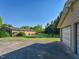 Expansive backyard featuring a spacious lawn, mature trees, and a glimpse of the house at 4170 Buckhorn Rd, Sanford, NC 27330