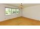 Bedroom featuring a large window providing natural light and carpeted flooring at 4170 Buckhorn Rd, Sanford, NC 27330