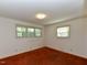 Spacious bedroom with two windows, a neutral color scheme and carpeted floor at 4170 Buckhorn Rd, Sanford, NC 27330