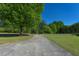 Wide driveway and front yard with mature trees at 4170 Buckhorn Rd, Sanford, NC 27330