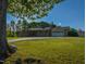 Charming brick home featuring an attached garage and expansive front yard with mature trees at 4170 Buckhorn Rd, Sanford, NC 27330