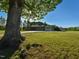 Charming home with a well-maintained front yard, mature tree, and attached two-car garage at 4170 Buckhorn Rd, Sanford, NC 27330