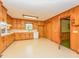 A kitchen with wooden cabinets, a window above the sink, and a doorway to another room at 4170 Buckhorn Rd, Sanford, NC 27330