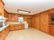 The kitchen has wooden cabinets, a window above the sink, and white appliances at 4170 Buckhorn Rd, Sanford, NC 27330