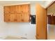 A storage area with wooden cabinets and an electrical panel at 4170 Buckhorn Rd, Sanford, NC 27330