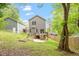 Backyard view showcasing a wooden deck with stairs leading to a concrete patio at 419 E East Hinton St, Clayton, NC 27520