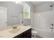 Bathroom featuring a shower-tub combo and vanity with marble countertops at 419 E East Hinton St, Clayton, NC 27520