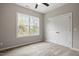Bedroom with large window and double door closet at 419 E East Hinton St, Clayton, NC 27520