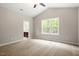 Cozy bedroom with large windows, plush carpet, and ensuite bathroom at 419 E East Hinton St, Clayton, NC 27520