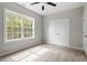 Cozy bedroom with a large window and ample closet space at 419 E East Hinton St, Clayton, NC 27520