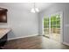 Bright dining area with wood-look floors and glass sliding doors to a rear deck at 419 E East Hinton St, Clayton, NC 27520