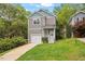 Charming two-story home with a one-car garage and beautifully landscaped front yard at 419 E East Hinton St, Clayton, NC 27520