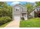 Charming two-story home with a one-car garage and beautifully landscaped front yard at 419 E East Hinton St, Clayton, NC 27520