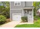 Charming two-story home featuring a one-car garage, covered entry, and manicured landscaping at 419 E East Hinton St, Clayton, NC 27520