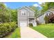 Charming two-story home with a one-car garage and beautifully landscaped front yard at 419 E East Hinton St, Clayton, NC 27520