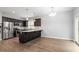 Bright kitchen with stainless appliances, island, and sliding doors to the rear deck at 419 E East Hinton St, Clayton, NC 27520