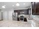 Well-equipped kitchen featuring stainless steel appliances, granite countertops, and ample cabinet space at 419 E East Hinton St, Clayton, NC 27520