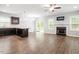 Spacious living room featuring hardwood floors, fireplace, ceiling fan and direct access to outdoor patio at 419 E East Hinton St, Clayton, NC 27520