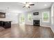 Bright living area featuring hardwood floors, fireplace, ceiling fan and direct access to outdoor patio at 419 E East Hinton St, Clayton, NC 27520