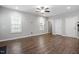 Hardwood floors highlight living room with neutral paint, white trim and abundant natural light at 419 E East Hinton St, Clayton, NC 27520