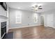 Living room featuring hardwood floors, neutral paint, white trim and abundant natural light at 419 E East Hinton St, Clayton, NC 27520