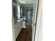 Modern bathroom with a double sink vanity, glass enclosed shower, and stylish gray tiling at 427 Lakeland St, Durham, NC 27701