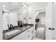 Modern bathroom features double sinks, a large mirror, and access to a stand-up shower and the main bedroom at 4412 Powell Grove Ct, Raleigh, NC 27606