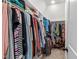 Walk-in closet with ample hanging space and shelving for clothing and accessories at 4412 Powell Grove Ct, Raleigh, NC 27606