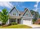 Beautiful two-story home with a well-maintained lawn and attached garage at 4412 Powell Grove Ct, Raleigh, NC 27606