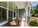 Cozy front porch featuring comfortable seating, perfect for relaxing and enjoying the neighborhood views at 4412 Powell Grove Ct, Raleigh, NC 27606